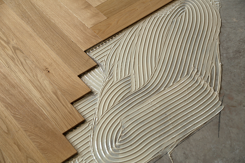 Prefinished engineered floor glued over concrete in a Central Street residence